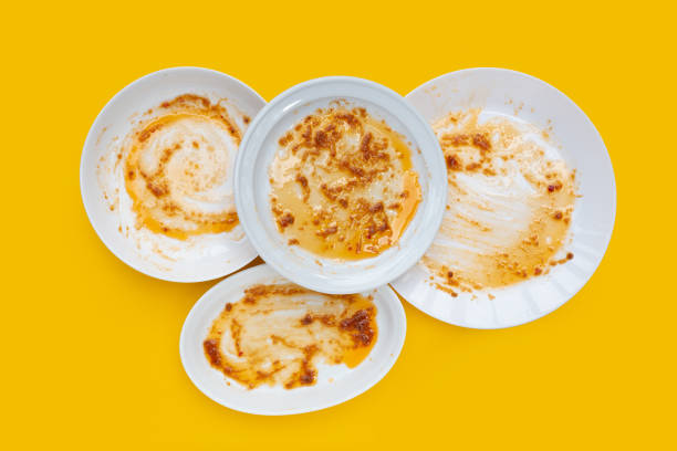 istock Dirty dishes on yellow background. Top view 1497087439