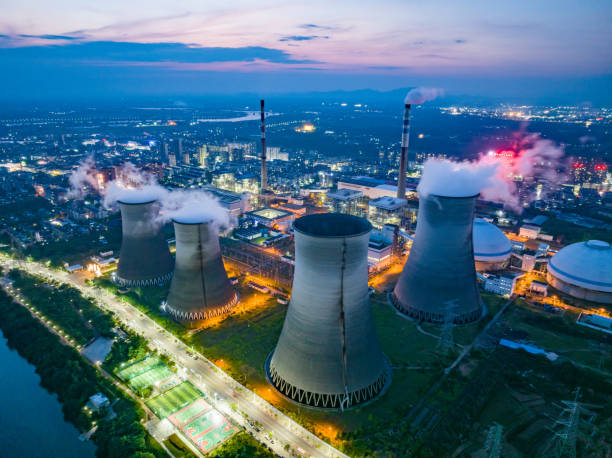 istock Thermal power plant night view, cooling tower 1497088933