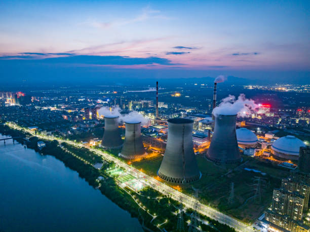istock Thermal power plant night view, cooling tower 1497088960