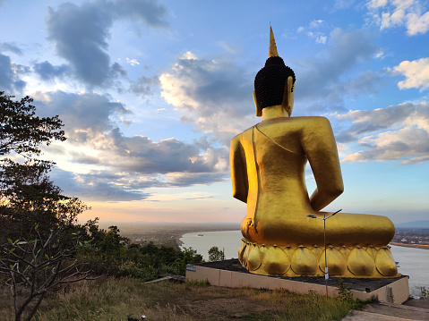 Big Buddha overlooking the Mekong river at Wat Phousalao (Golden Buddha temple), in Pakse, the capital and most populous city of province of Champasak, and the second most populous city in Laos.