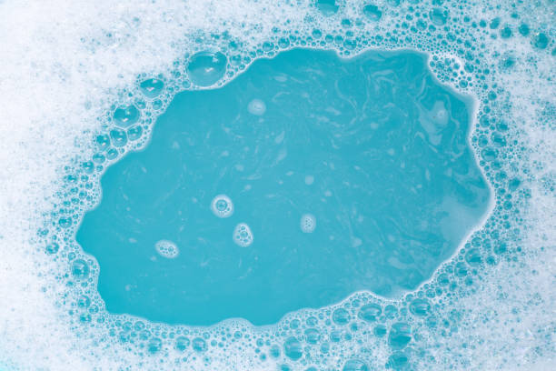 istock Detergent foam bubble on wate. Blue background, Soap sud 1497089125