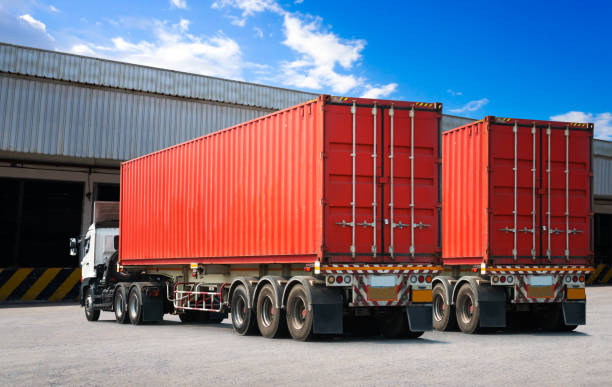 istock Semi Trailer Trucks on The Parking Lot. Trucks Loading at Dock Warehouse. Shipping Cargo Container Delivery Trucks. Distribution Warehouse. Freight Trucks Cargo Transport. Warehouse Logistics. 1497089978