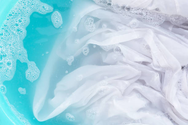 istock Soak a cloth before washing, white cloth 1497091535