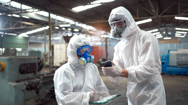 istock Chemists working in dangerous area. 1497091616