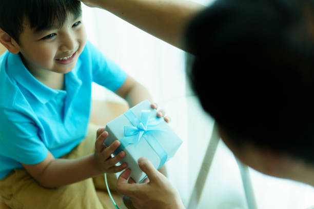 istock Little boy give his dad a Father's Day present. 1497091635