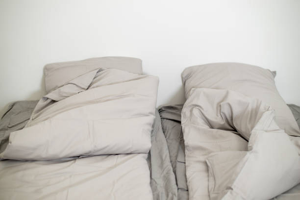 istock Empty bed in a white room. Hotel room, double bedroom. 1497091933