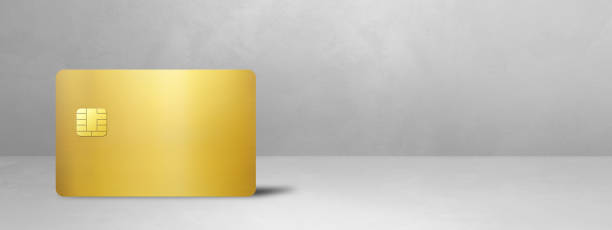 istock Gold credit card on a white concrete background 1497092686