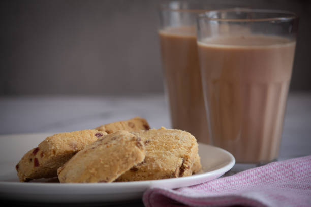 istock Refreshment time with cookies and a glass of tea. Tea time with snacks. 1497094054