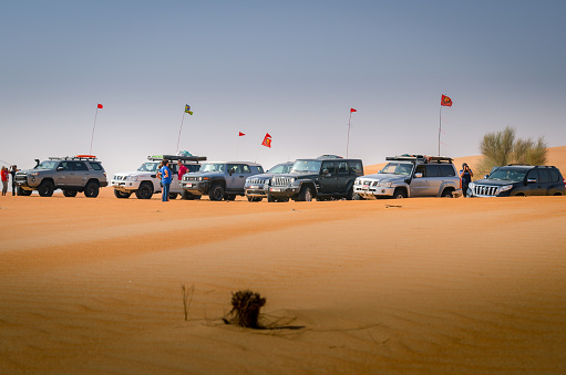 Abu Dhabi,UAE-December 15, 2019: Group of safari off road 4x4 car trip enjoy the scenery  in the desert