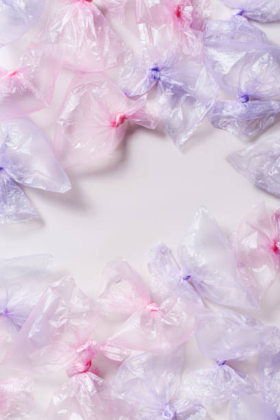 istock Plastic free environment protection concept. Empty used plastic bags,  frame background, copy space. Aesthetic top view colored disposable transparent polyethylene packet. Plastic bag free day 1497096174