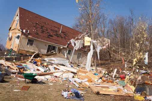 Image of a home heavily damaged by an F2 tornado that swept through Oregon Twp in Lapeer County, MI on March 15, 2012. The house was lifted from its foundation. The photo was taken the next day on March 16, 2012.