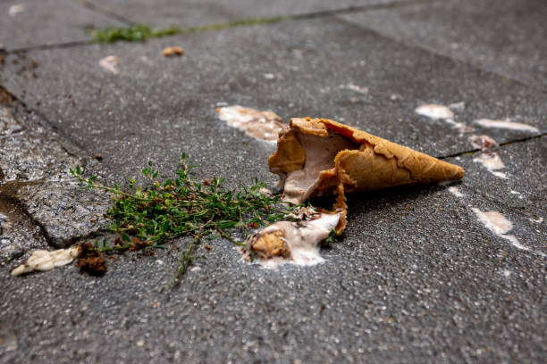 istock an ice cream cone dropped on the street 1497099954