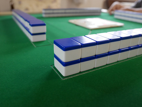 Mahjong tiles on a neatly arranged table