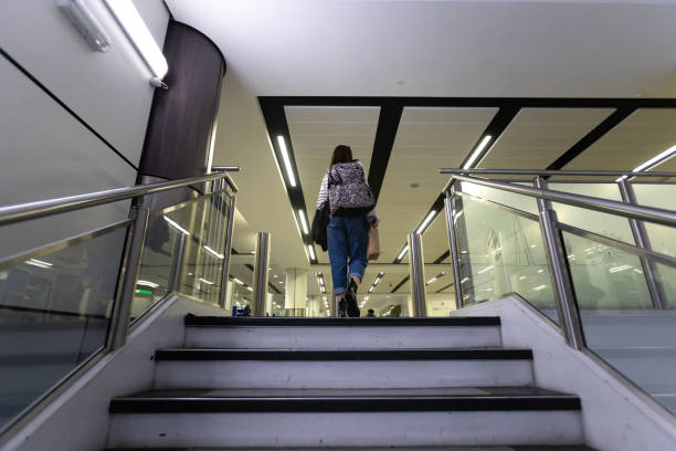 istock Women walking by window at airport 1497107459