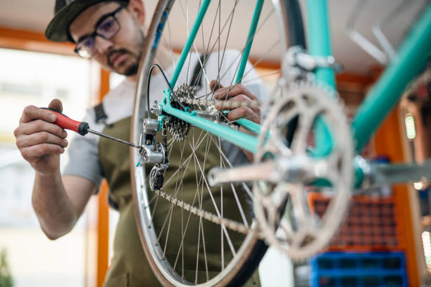 istock Dedicated to his work to make this vintage bicycle look new again. 1497107527