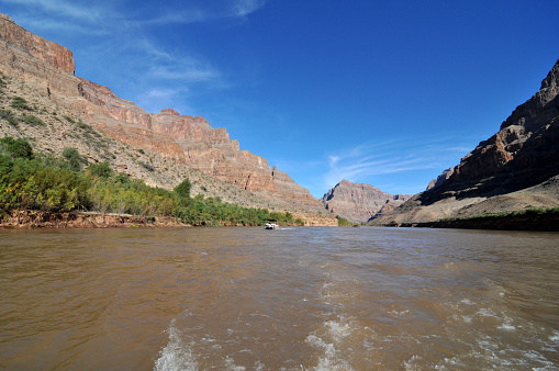 Arizona, USA- October 10, 2011: Grand Canyon National Park, in northern Arizona, encompasses 278 miles of the Colorado River and adjacent uplands, is one of the most spectacular examples of erosion anywhere in the world. Grand Canyon National Park is a World Heritage Site. Here is the gorgeous view of the Colorado River on the bottom of the Grand Canyon.