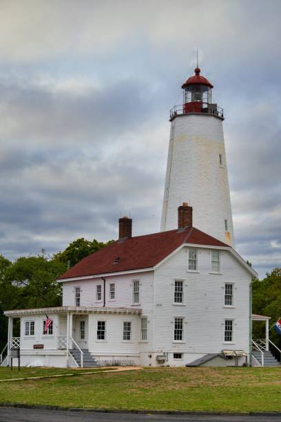 istock Vertical of Sandy Hook Lighthouse in New Jersey on a cloudy day 1497109725