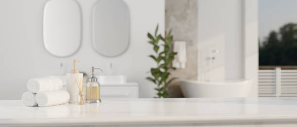 istock Copy space on a luxury white tabletop with toiletries set in a luxury white bathroom with bathtub 1497110764