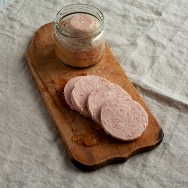 istock Homemade Jagdwurst on a rustic wooden board, side view. 1497113737
