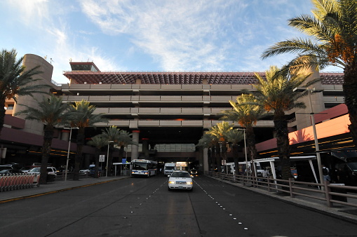 Las Vegas, NV, USA- October 11, 2011: Hoover Dam is a concrete arch-gravity dam in the Black Canyon of the Colorado River, on the border between the U.S. states of Nevada and Arizona. Here is the terminal building of Las Vegas Airport.