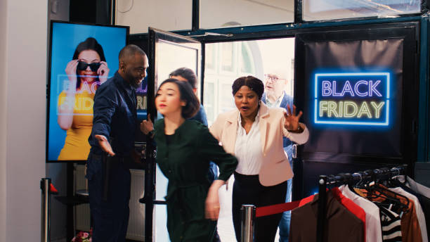 istock Shoppers push red tape entering store 1497115593