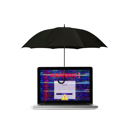 Close-up of laptop with warning sign protected by black umbrella on white background.