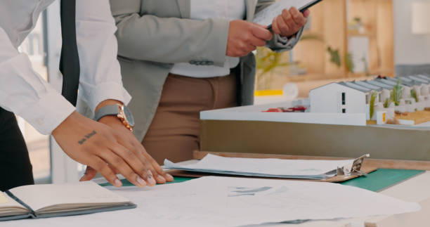 istock Architecture, hands and paperwork in office with discussion of prototype for construction. Engineer, project and closeup of collaboration for building design 1497121011