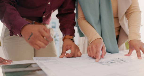 istock Architecture, hands and meeting for design, drafting property and building contractor. Engineer, employees and closeup in office with floor plan, schematics and proposal 1497121111
