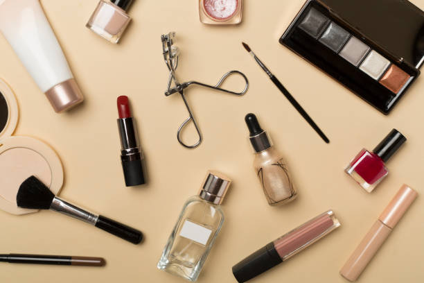 istock Different makeup products on color background, top view 1497122692