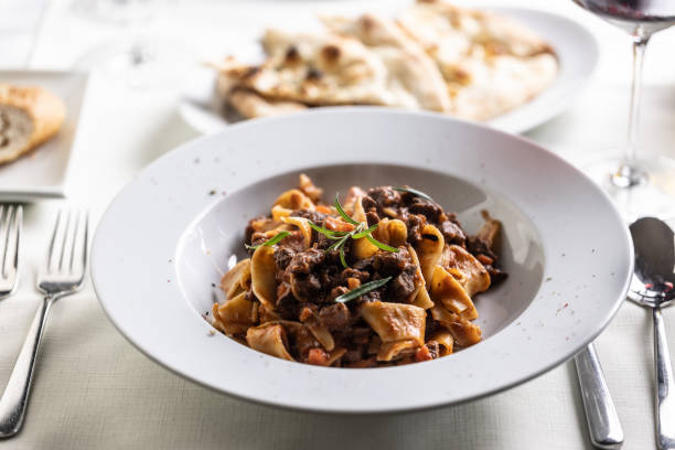 istock Papardelle al cinghiale, a Sienese typical dish with game ragout in a plate. 1497122849