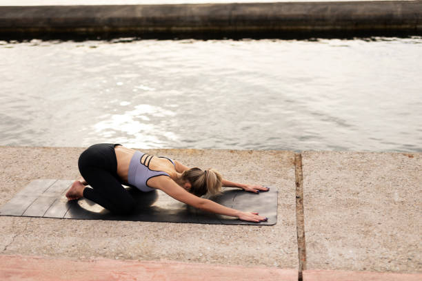 istock Young woman doing stretching exercise after running outside. 1497123343