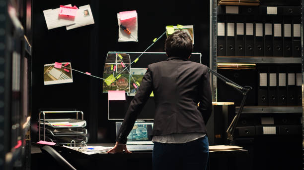 istock Investigator looking at clues board 1497124536