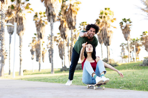 istock Boyfriend and girlfriend with skateboard. 1497125103