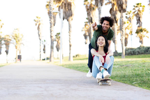 istock Boyfriend and girlfriend with skateboard. 1497125164