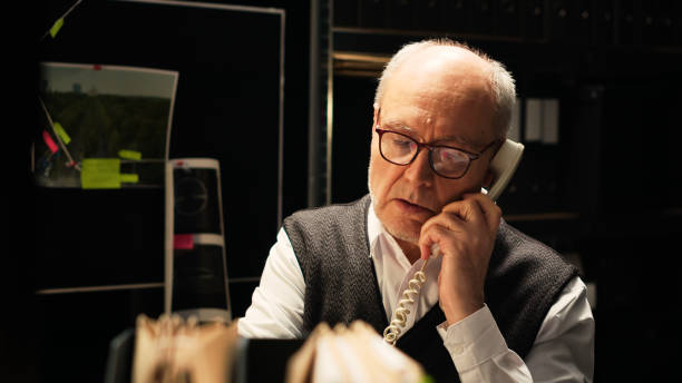 istock Man investigator making phone call 1497126009