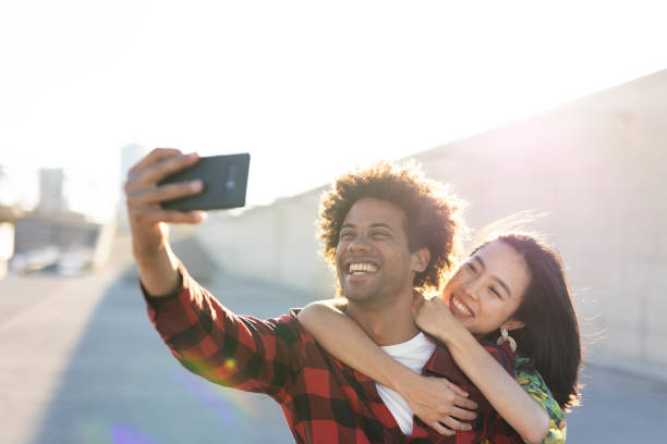 istock Loving couple taking selfie photo 1497126036