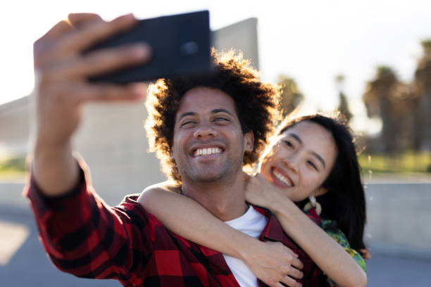 istock Loving couple taking selfie photo 1497126040