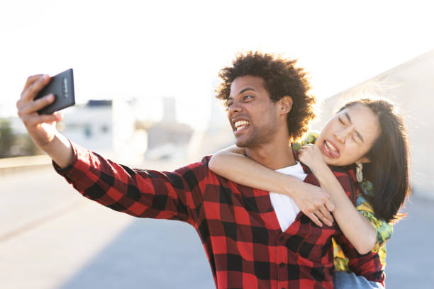 istock Loving couple taking selfie photo 1497126052
