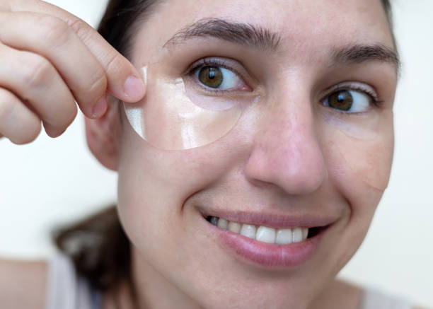 istock woman applying under eye patches isolated 1497127173