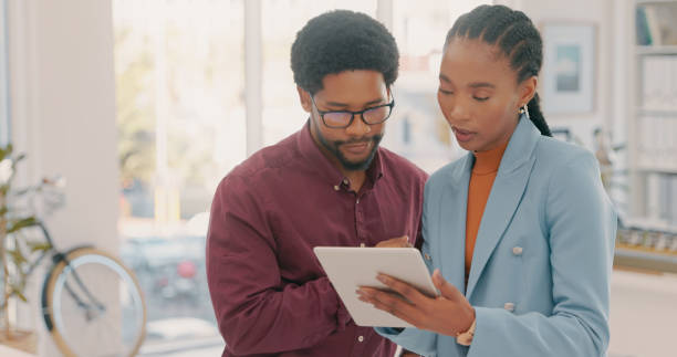 istock Planning, advice and black people with tablet for internet proposal, project discussion and website. Collaboration, connection and employees with digital technology for online strategy 1497133630