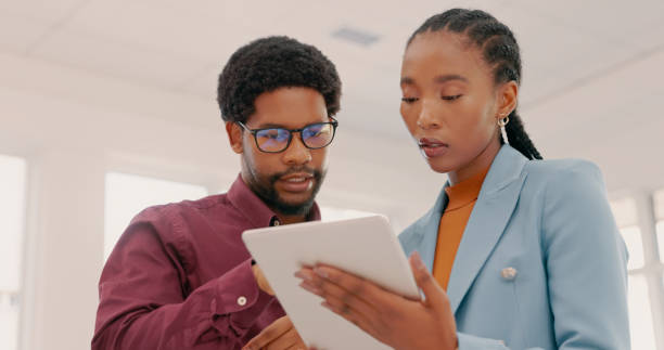 istock Planning, advice and black people with tablet for internet proposal, project discussion and website. Collaboration, connection and employees with digital technology for online strategy 1497133631