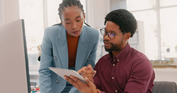 istock Black people, business and teamwork on computer, tablet and technology for planning, strategy and data analytics. Employees consulting digital website for collaboration, research or office project 1497133658