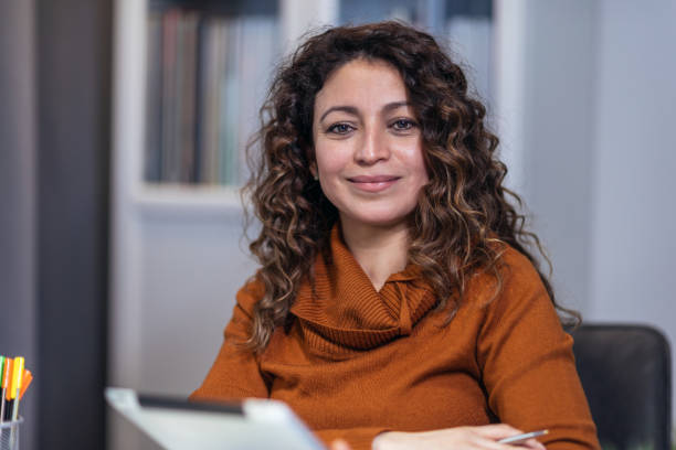 istock Attractive woman working on a tablet in a home office. 1497135225