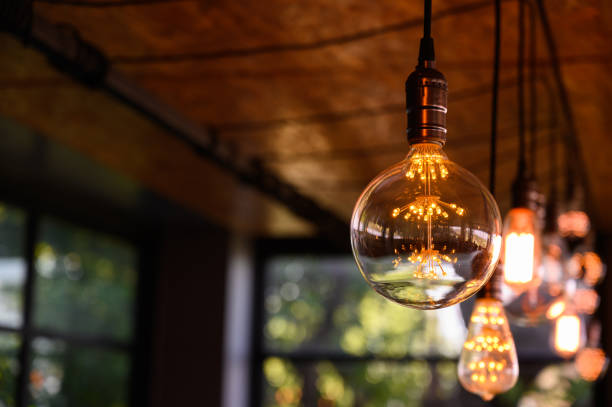 istock Beautiful vintage light bulb. Retro luxury light bulb hanging decor glowing. 1497136684