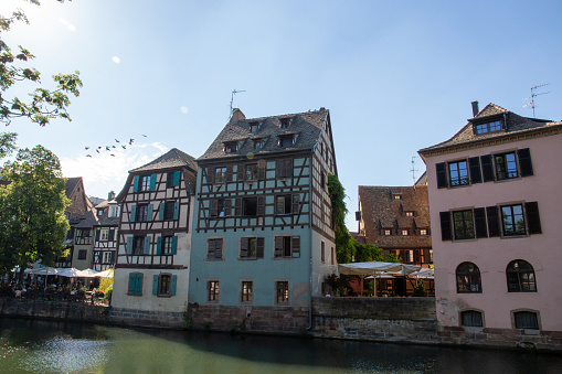 Colored houses in a French village along a canal in the Alsace area