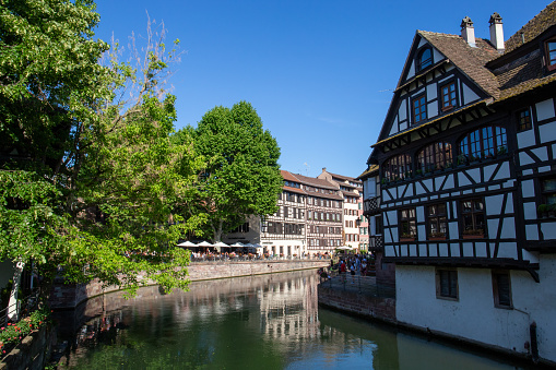 Colored houses in a French village along a canal in the Alsace area