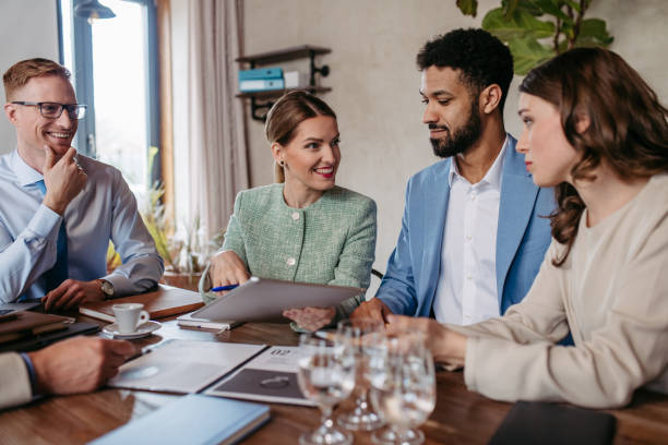 istock Young colleagues having casual discussion during meeting in office. 1497136917
