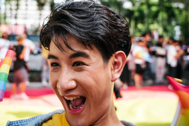 Portrait of a asian gay man while waiting the LGBTQI parade
