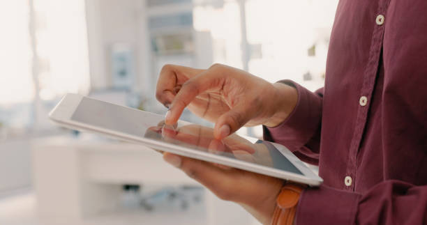 istock Business, closeup and man with tablet, hands and online research, internet and data analysis in office. Employee with digital technology for planning, analytics and connection 1497138537