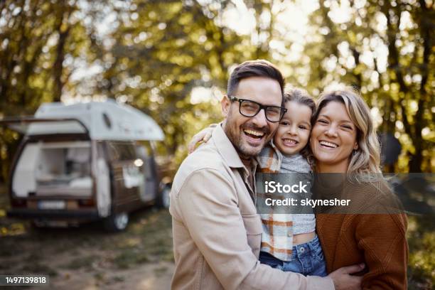 Portrait Of Happy Family In Autumn Day At Trailer Park Stock Photo - Download Image Now